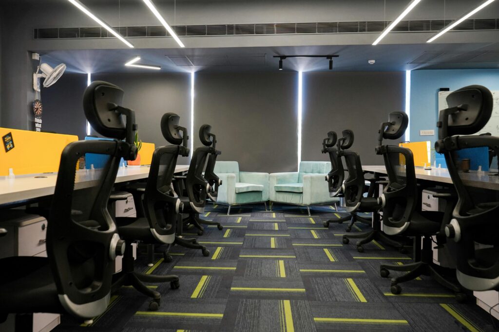 metal-roof Spacious modern office with ergonomic chairs and bright decor, perfect for a productive work environment.